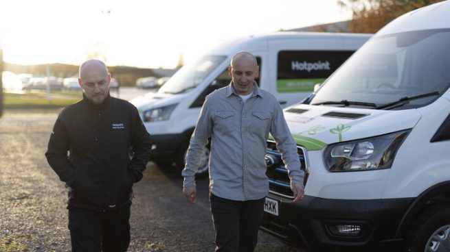Hotpoint fleet manager and engineer walking next a fleet Ford E-Transits.